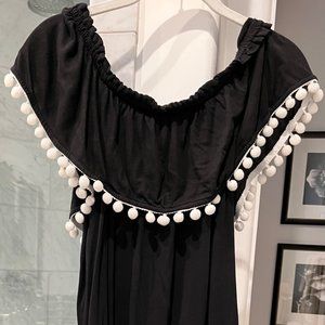 Black dress with white pom poms